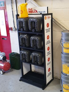 a display of shell helix motor oils in a garage