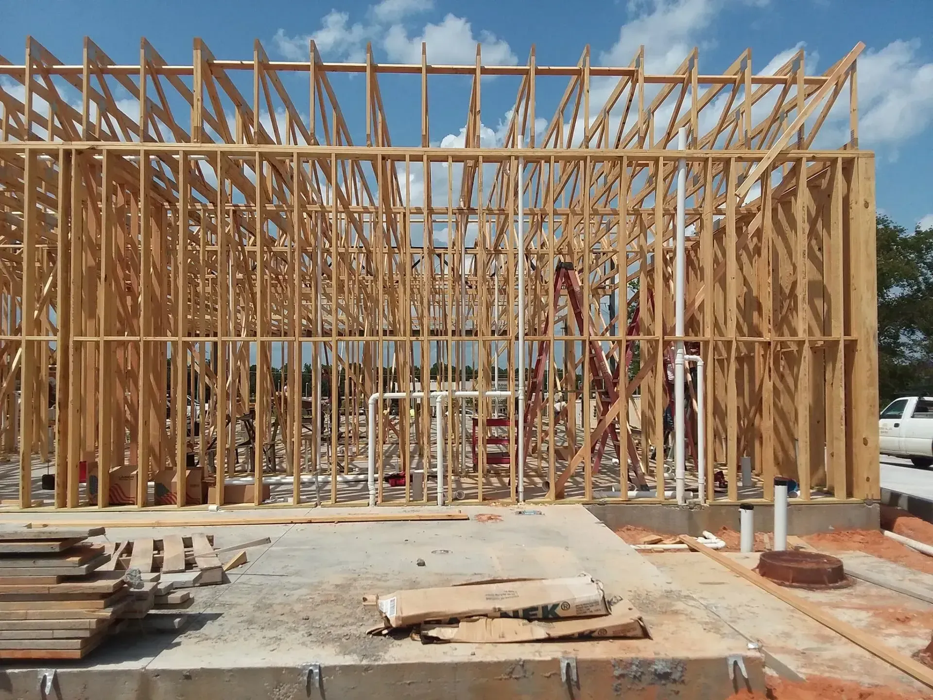 Castleberry's Plumbing LLC- A house is being built with a lot of wooden beams
