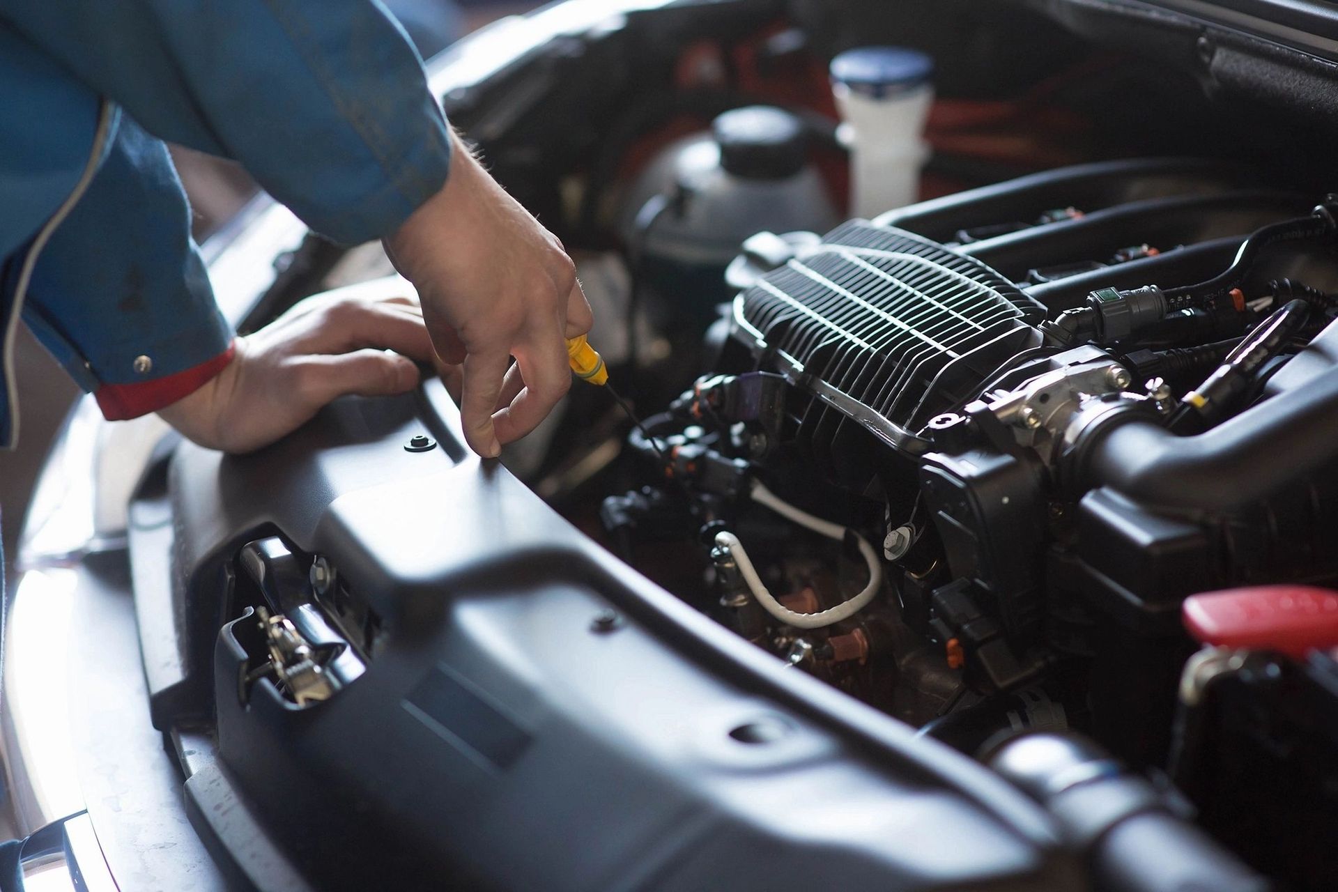 Mechanic Working On A Car Engine
