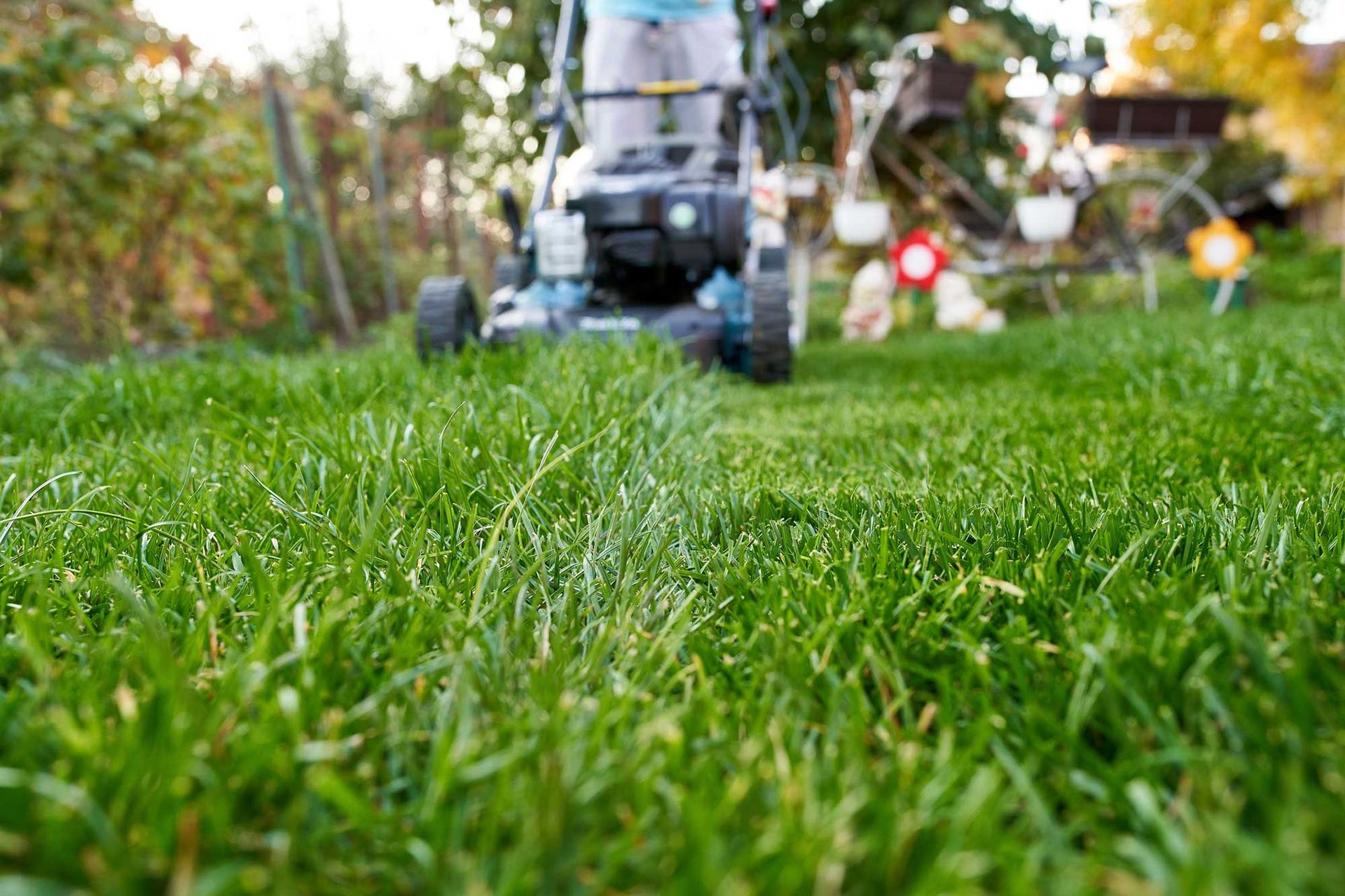 Man Mowing the Lawn — Troy, NY — Dobert’s Landscaping LLC