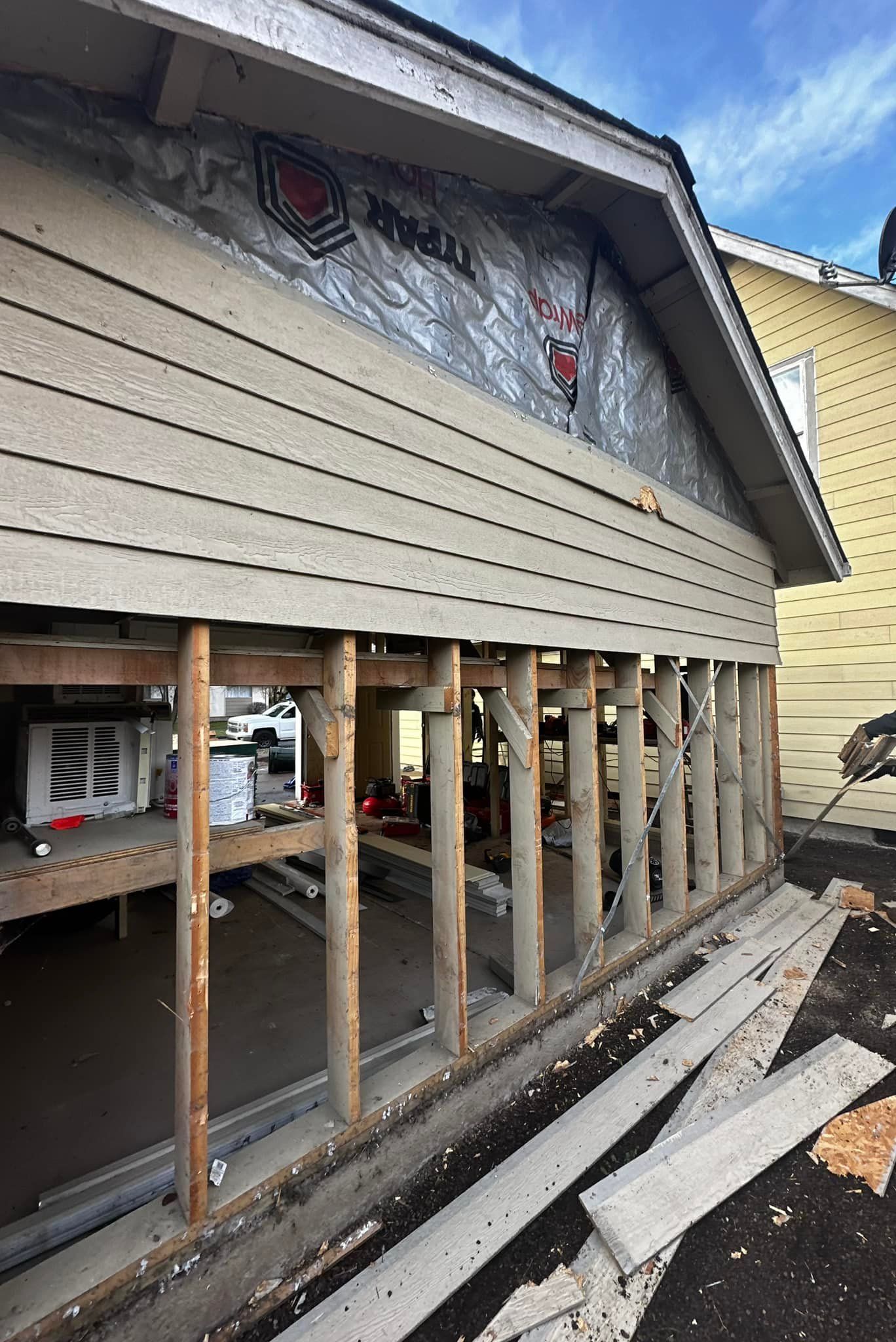 A house is being built with a lot of wooden beams.
