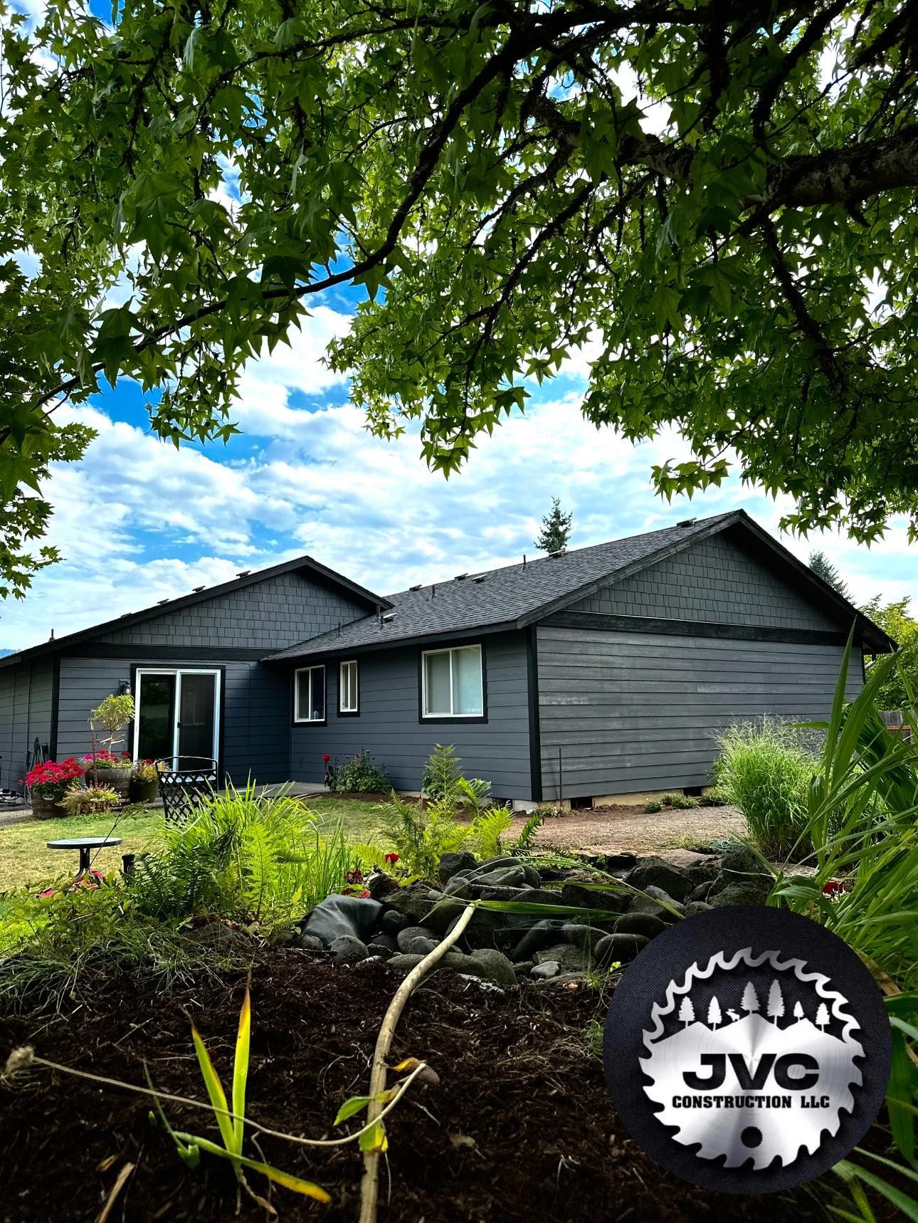 A house with a circular saw blade in front of it.