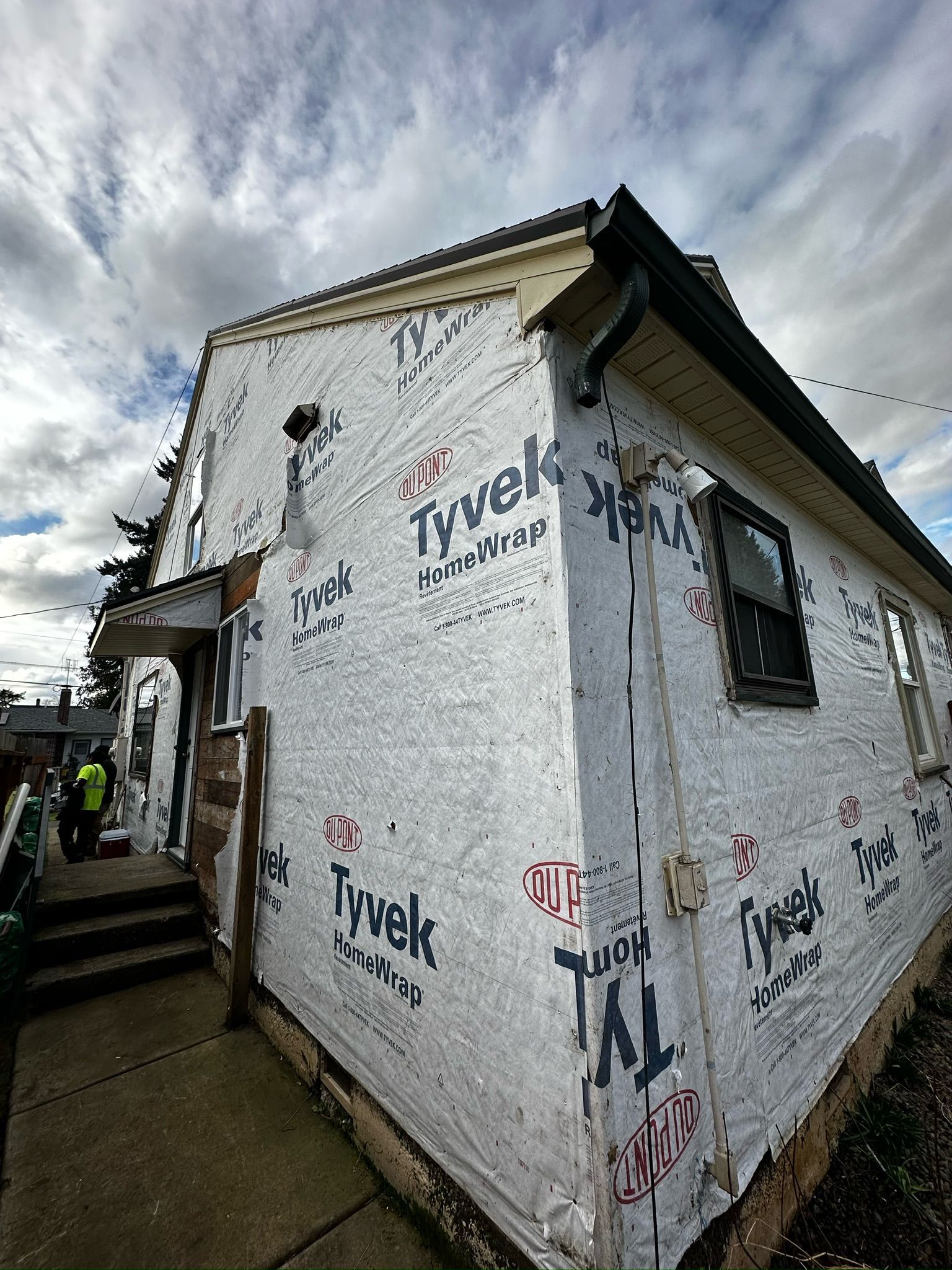 A white house with a lot of graffiti on it.