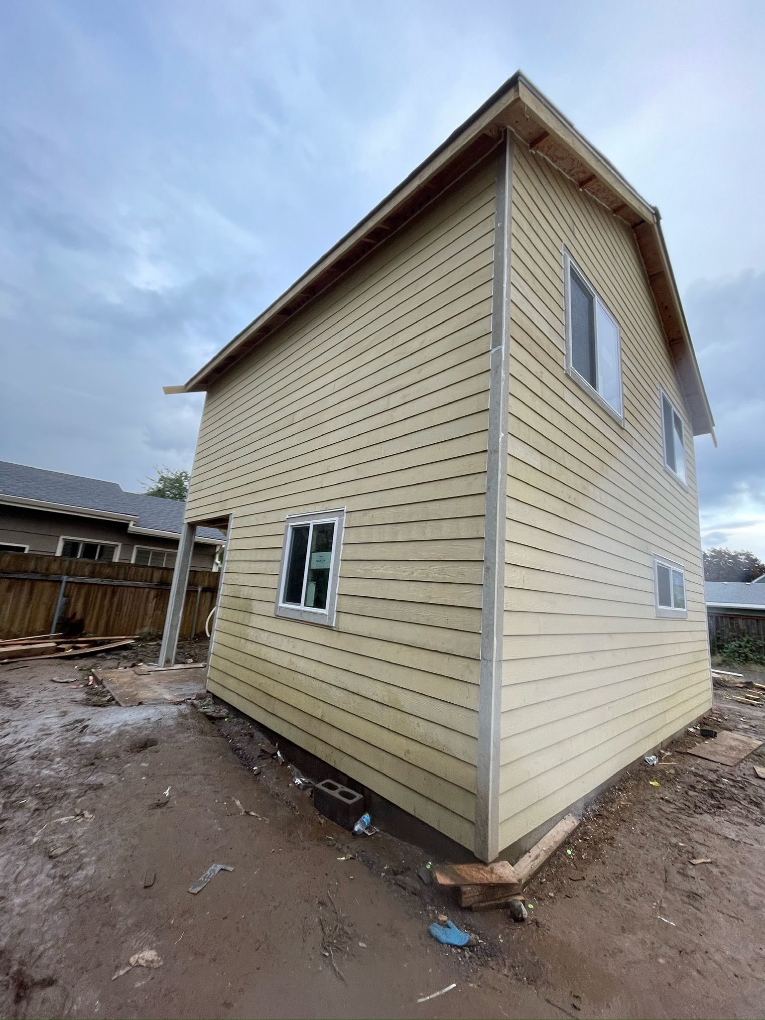A house with a lot of windows is being built.
