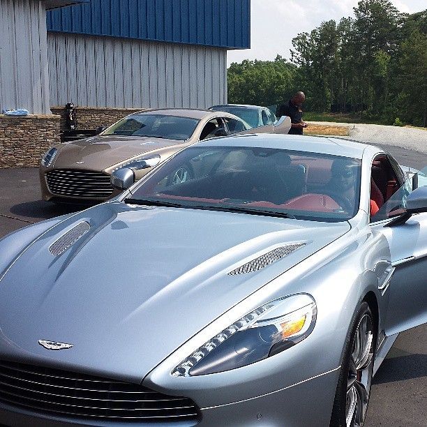 Silver Aston Martin sports cars after luxury auto detailing treatment