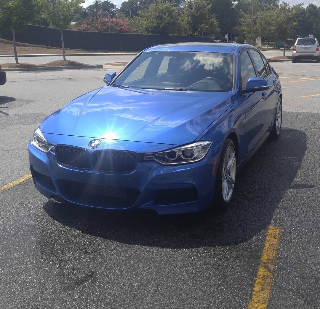 Blue BMW sedan with polished exterior from professional auto detailing