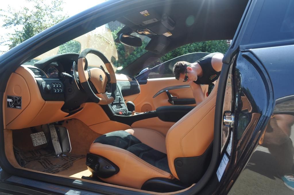 Luxury car interior cleaning during professional auto detailing service