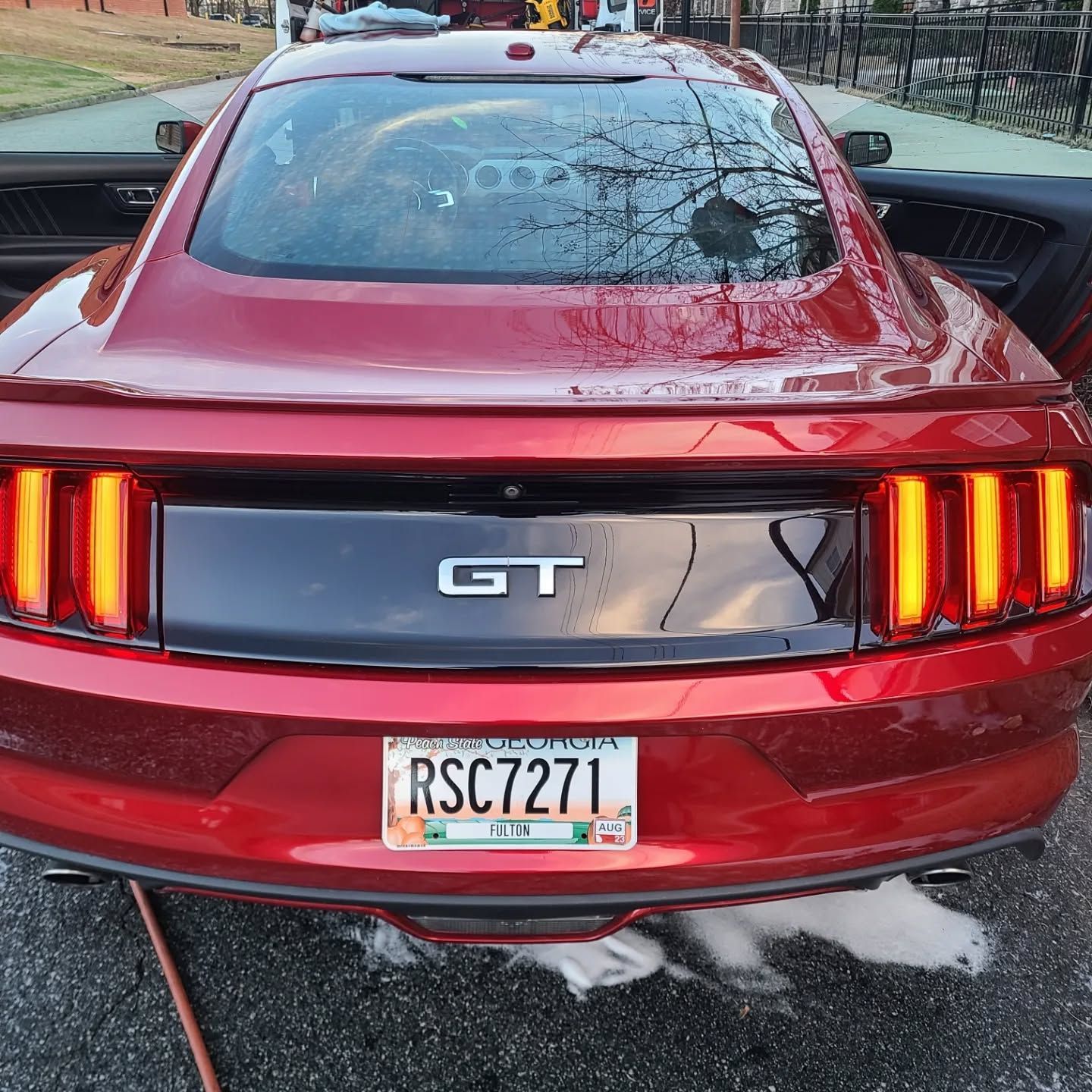 Red Ford Mustang GT after premium exterior car detailing