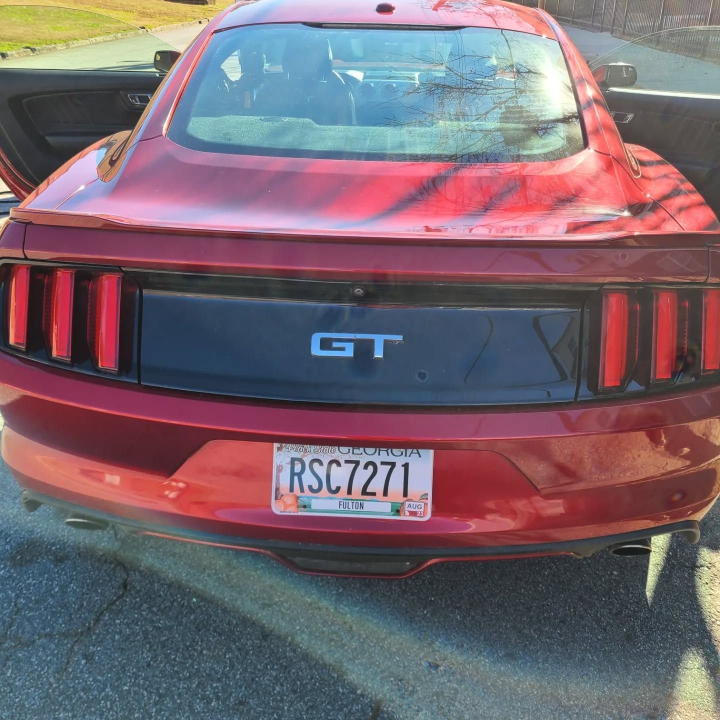 Red Ford Mustang GT after premium exterior car detailing