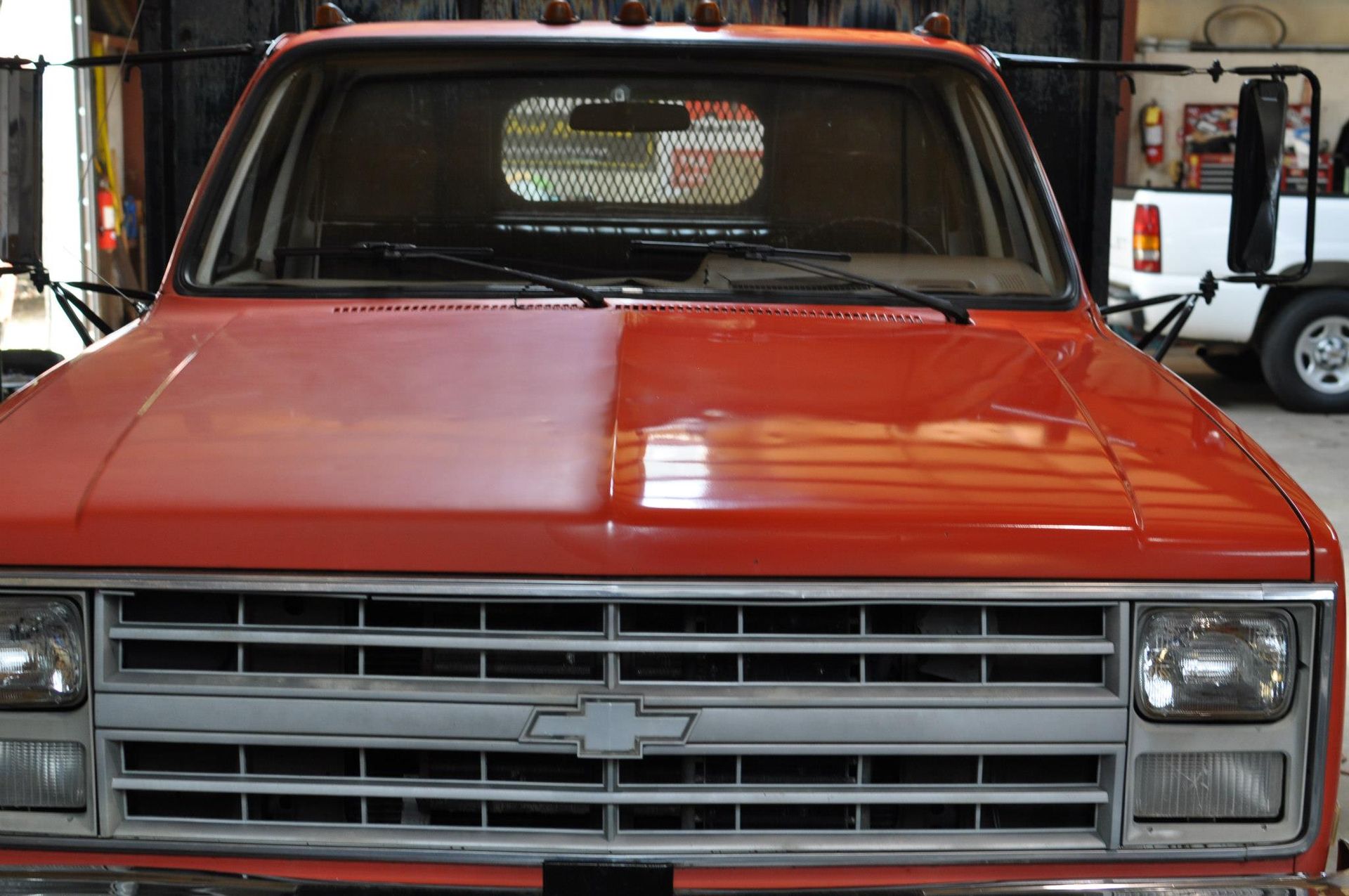 Chevrolet truck hood before and after paint correction detailing