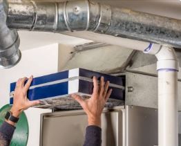 hvac technician installing air filters