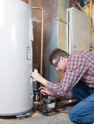 hvac technician fixing a water heater in an emergency