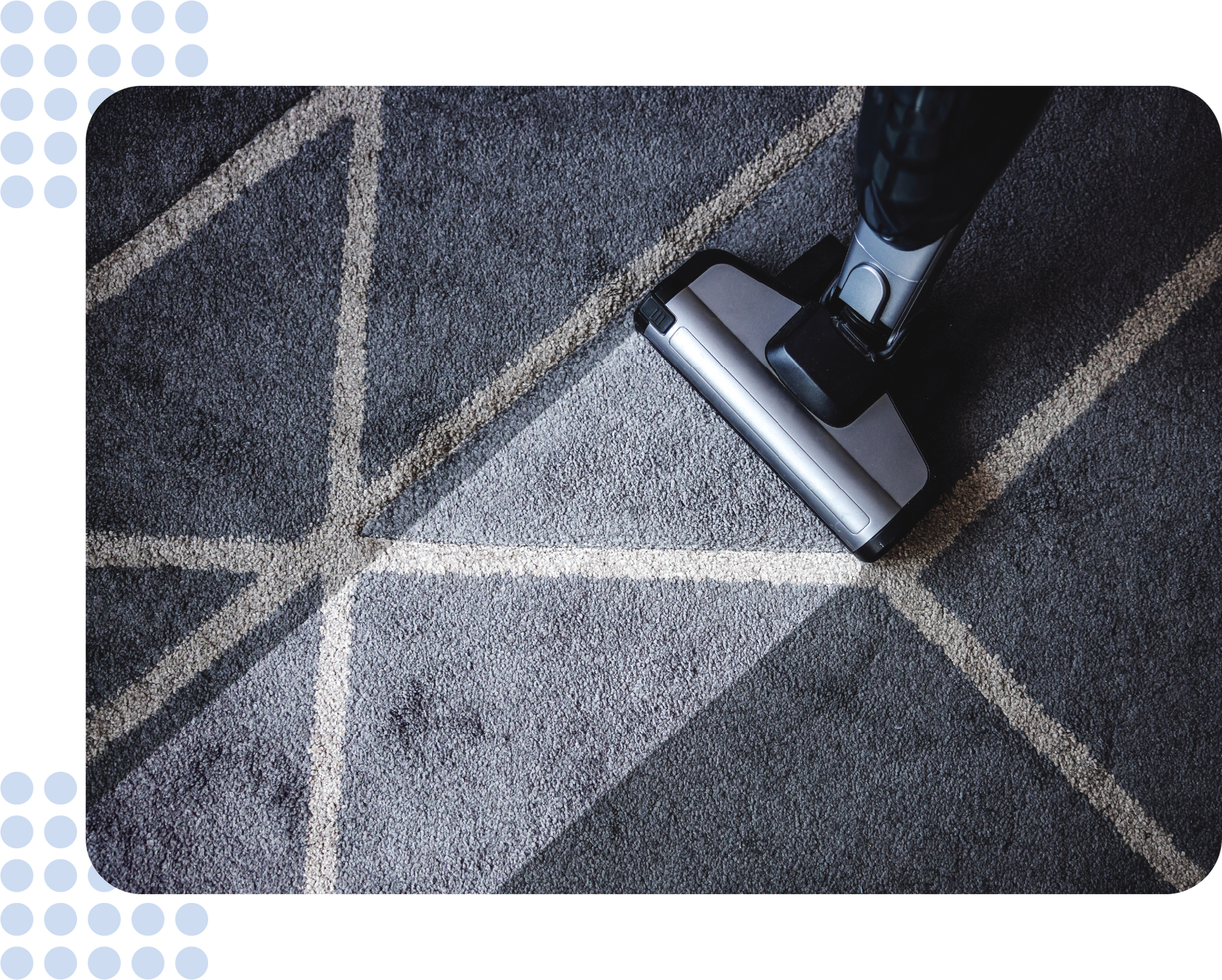 A person is using a vacuum cleaner to clean a carpet.