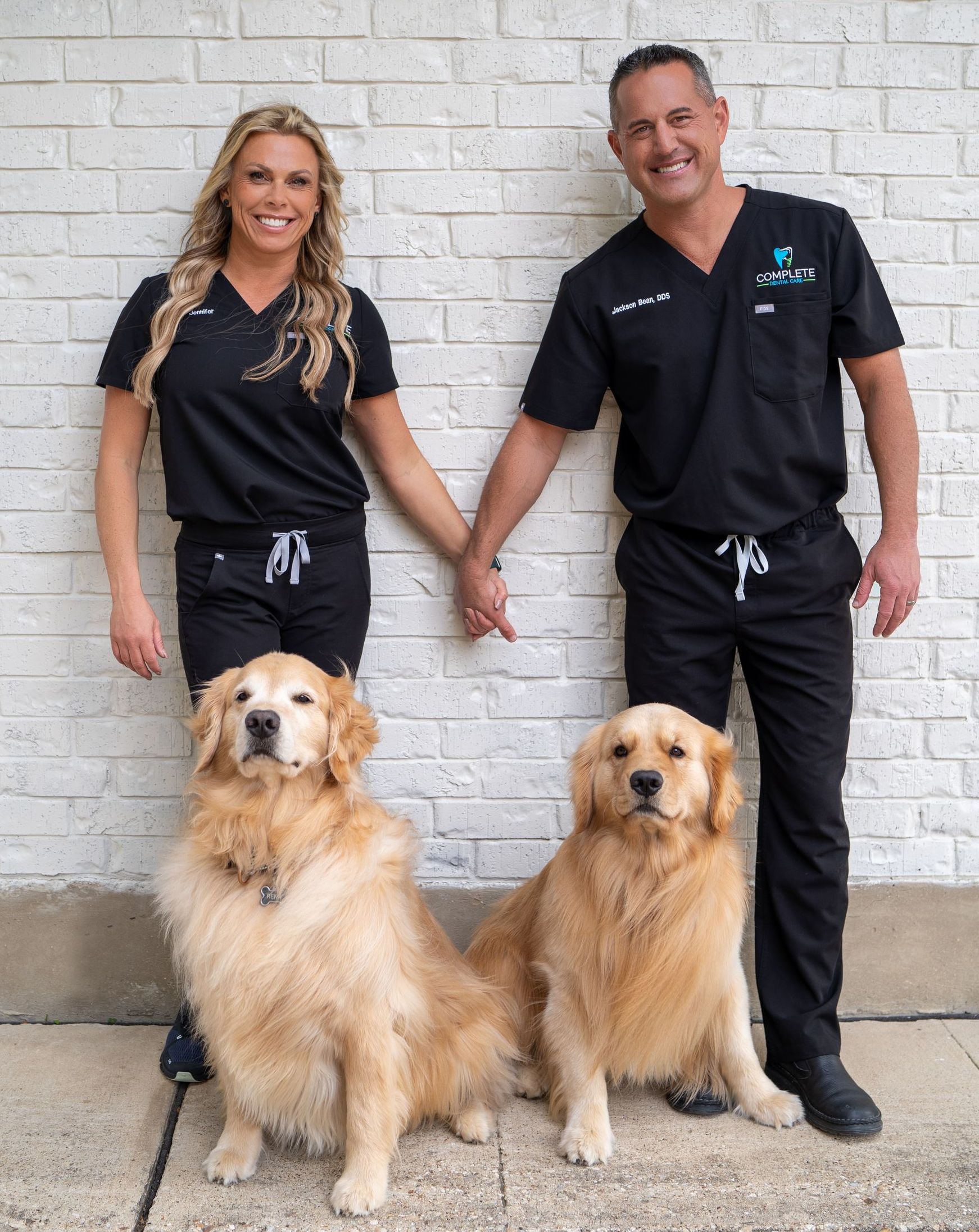 Dr. Bean with his wife Jennifer and two dogs, Remy and Milo