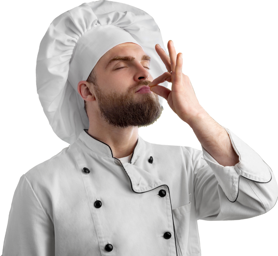 A chef is covering his nose with his hand