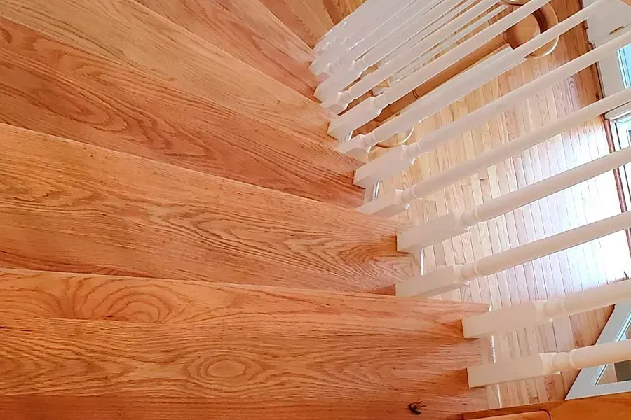 Wooden staircase with white railing