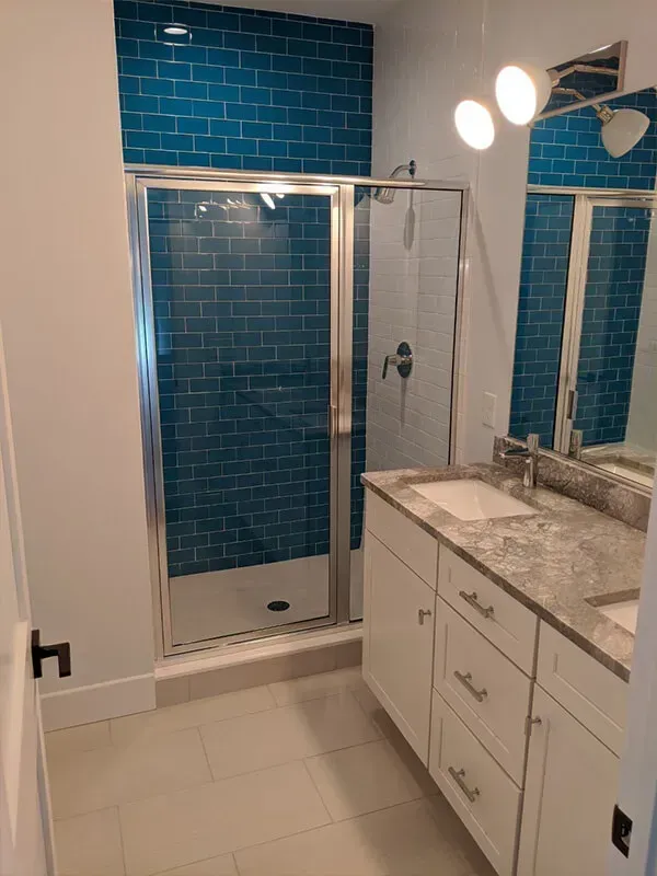 The room has gray flooring and white cabinetry.