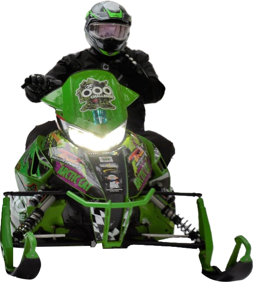 a man is riding a green snowmobile