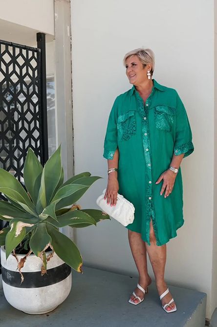 Woman Wearing Green Dress And White Sandals With Heels While Holding Handy Bag — Zest Boutique in Yeppoon, QLD