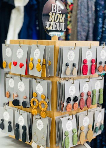 Woman Earing Display — Women’s Fashion Boutique in Yeppoon, QLD