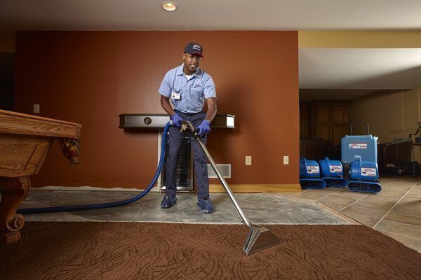 a worker cleaning with the water extraction process