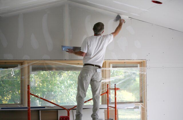 man repair drywall