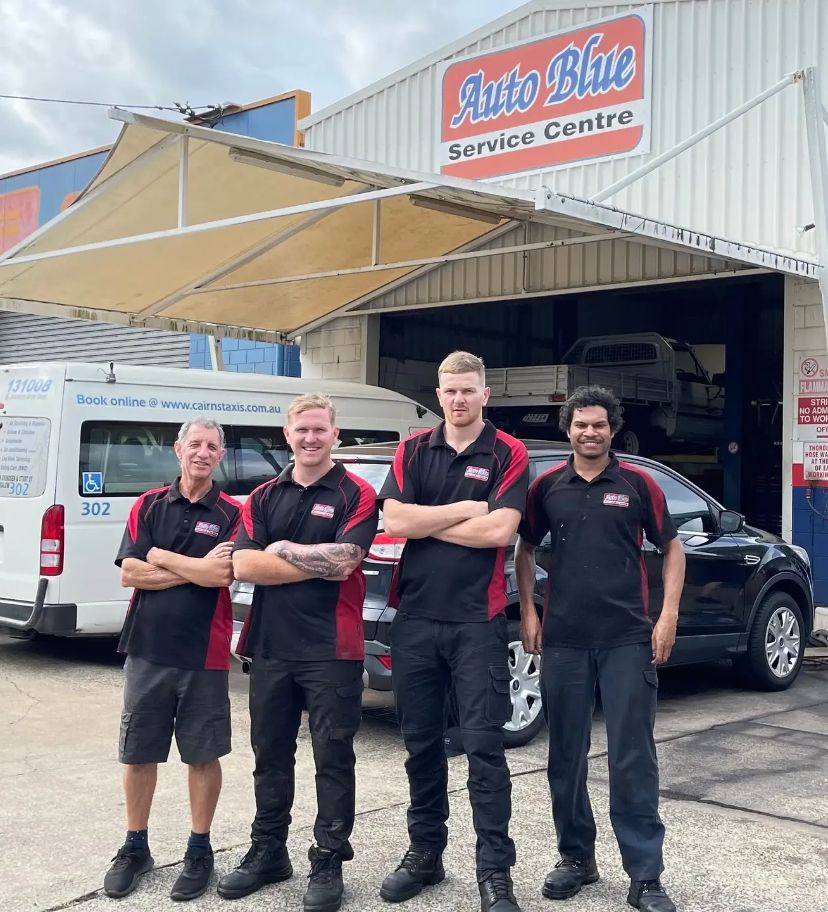 A Group of Men Are Standing — Auto Blue Service Centre In Bungalow, QLD