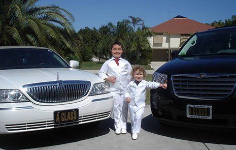 Two Kids Infront Of Limousine — Marco Island, FL — A Class Transportation