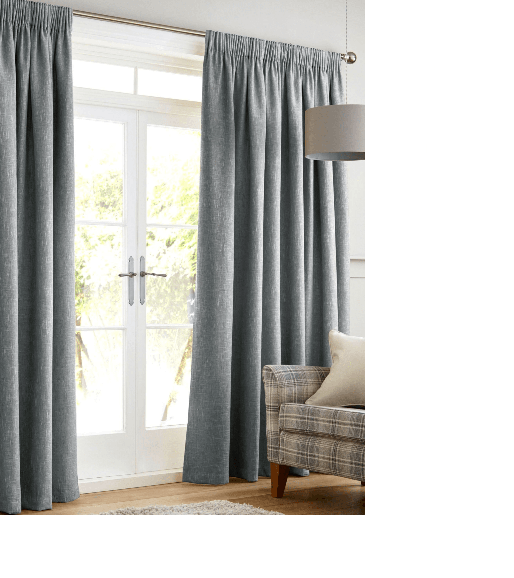Grey coloured curtains hanging over glass doors in a living room