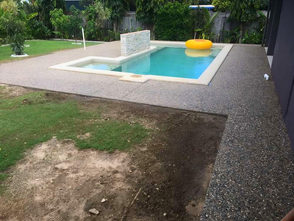 A Large Swimming Pool With A Yellow Float In It — Tropical North Concreting In Trinity Park, QLD