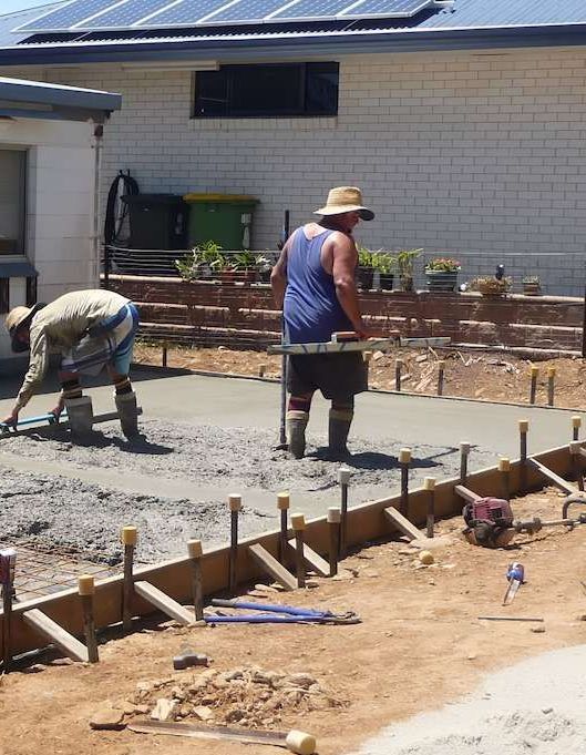 A Pile Of Logs Laying On The Ground In The Woods — Tropical North Concreting In Trinity Park, QLD
