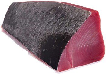 Raw tuna steak, dark exterior and vibrant pink flesh.