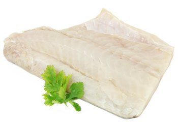 White fish fillet with a sprig of green herbs.