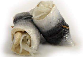 Herring rolls: fish fillets wrapped around onions, secured with a toothpick.