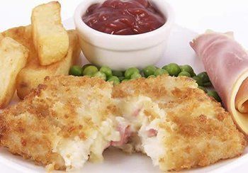 Breaded and fried potato cake with ham inside, served with fries, peas, ketchup, and ham.
