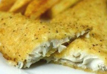 Fried fish fillet, golden and flaky, broken open to reveal white fish.