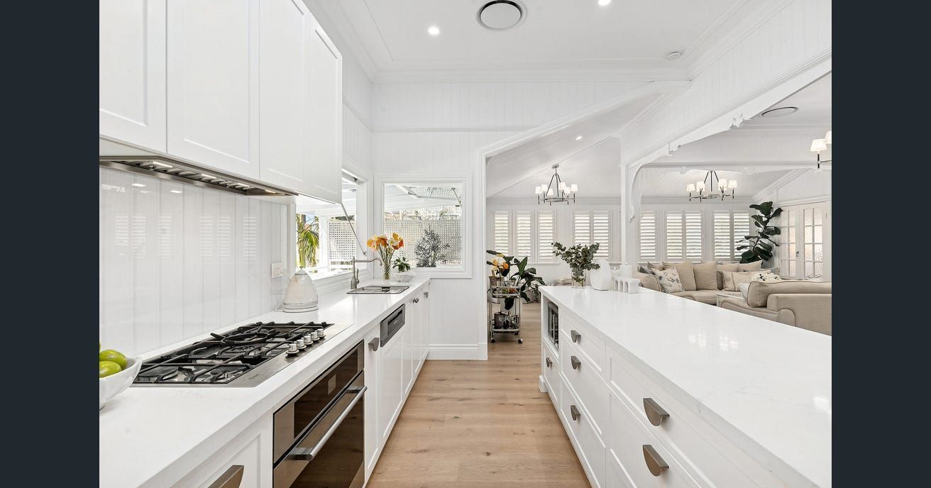 Modern Kitchen With White Cabinets — Caprice Cabinets in Coolum Beach, QLD