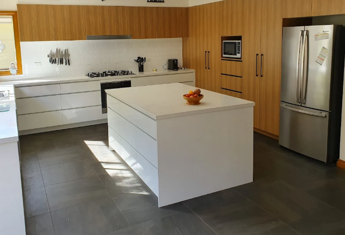 Modern Kitchen With Dark Brown Cabinets — Caprice Cabinets in Noosa, QLD
