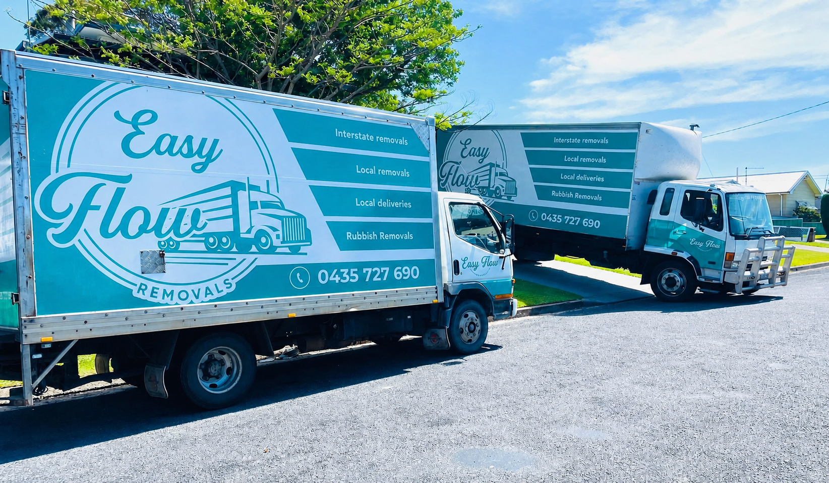 A White Truck Is Parked In Front Of A Brick Building — Easy Flow Removals In Port Macquarie, NSW