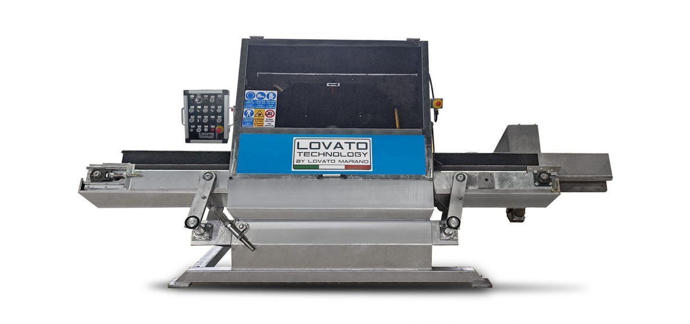A machine with a blue top is sitting on a white surface.