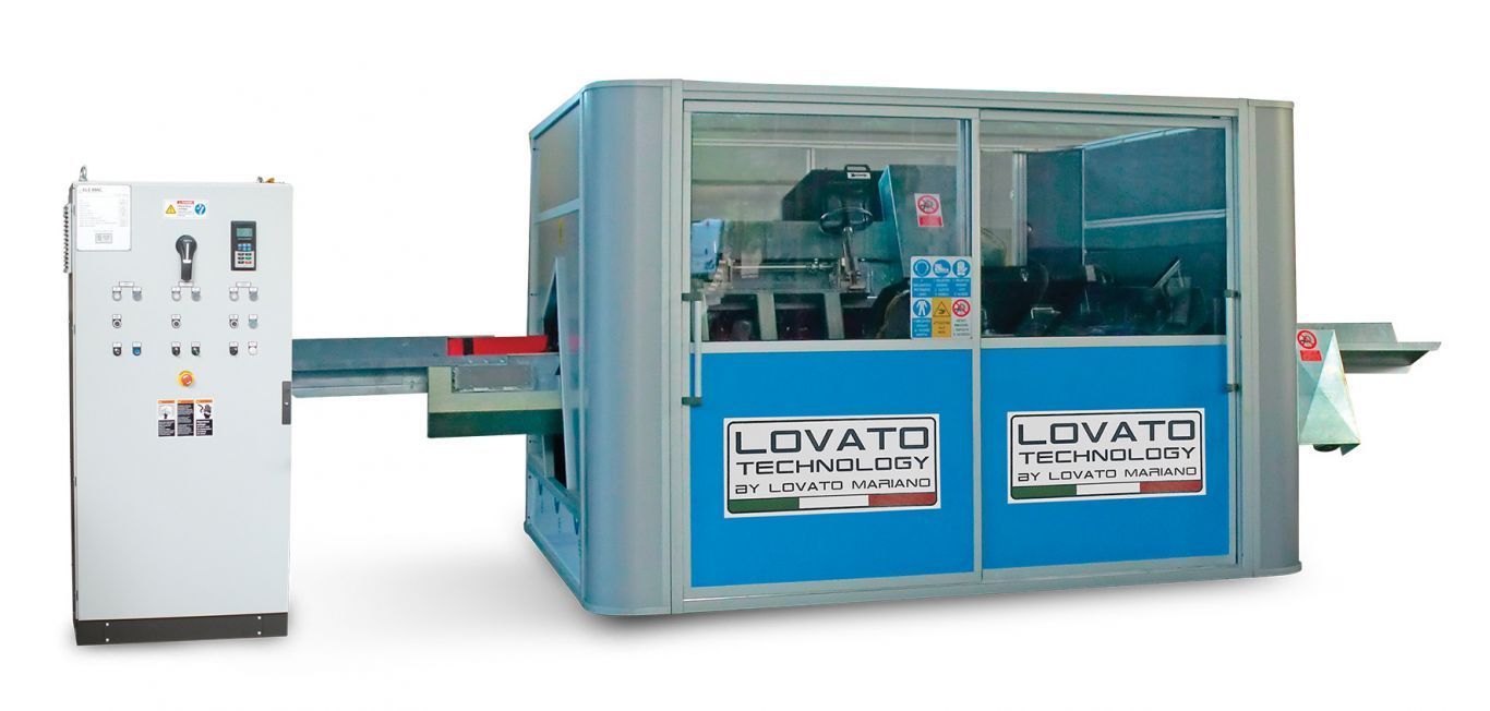 A lovato machine is sitting next to a control panel.