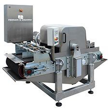 A stainless steel machine with a conveyor belt attached to it.