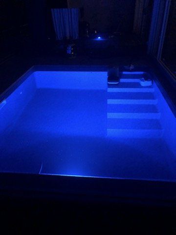 liner installed on rectangular inground pool - view at night