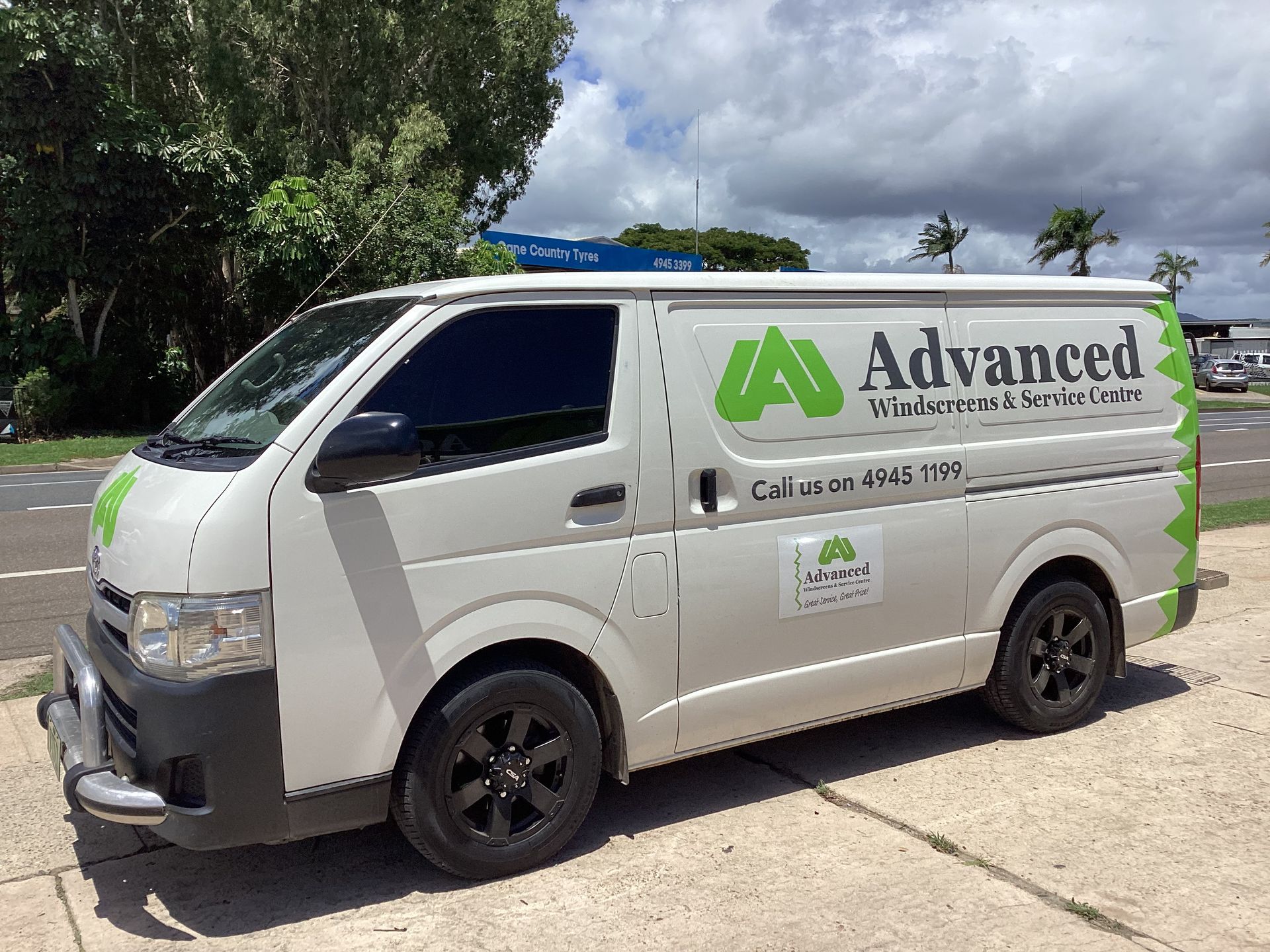 A White Van Is Parked In A Driveway — Advanced Windscreens & Service Centre In Proserpine, QLD