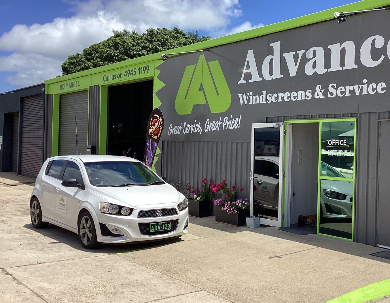 A Car Is Sitting In Front of A Garage — Advanced Windscreens & Service Centre In Proserpine, QLD