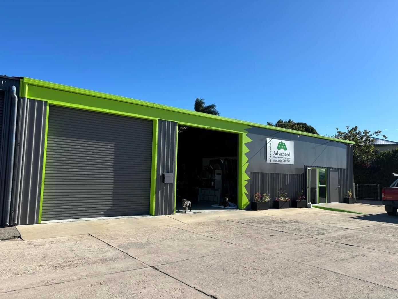 A Green And Gray Building — Advanced Windscreens & Service Centre In Bowen, QLD