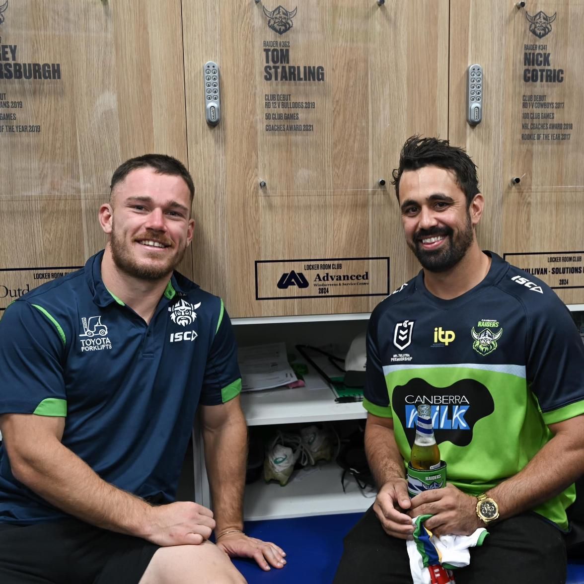Two Men Standing In Front Of A Wooden Wall — Advanced Windscreens & Service Centre In Proserpine, QLD