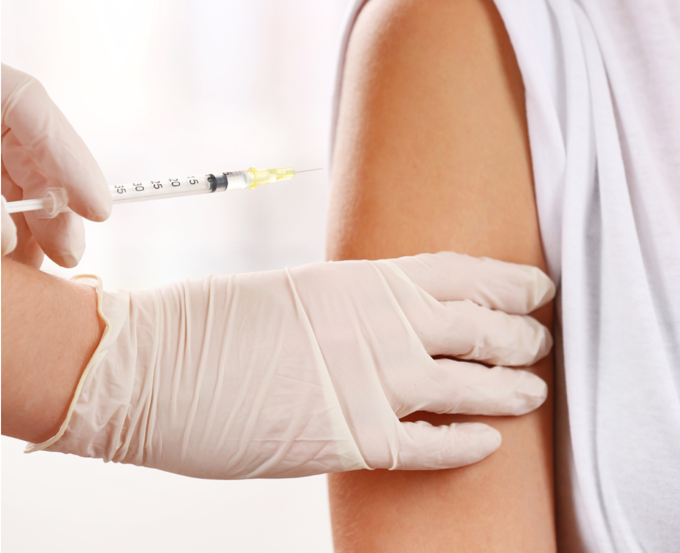 A woman is getting a botox injection in her face.