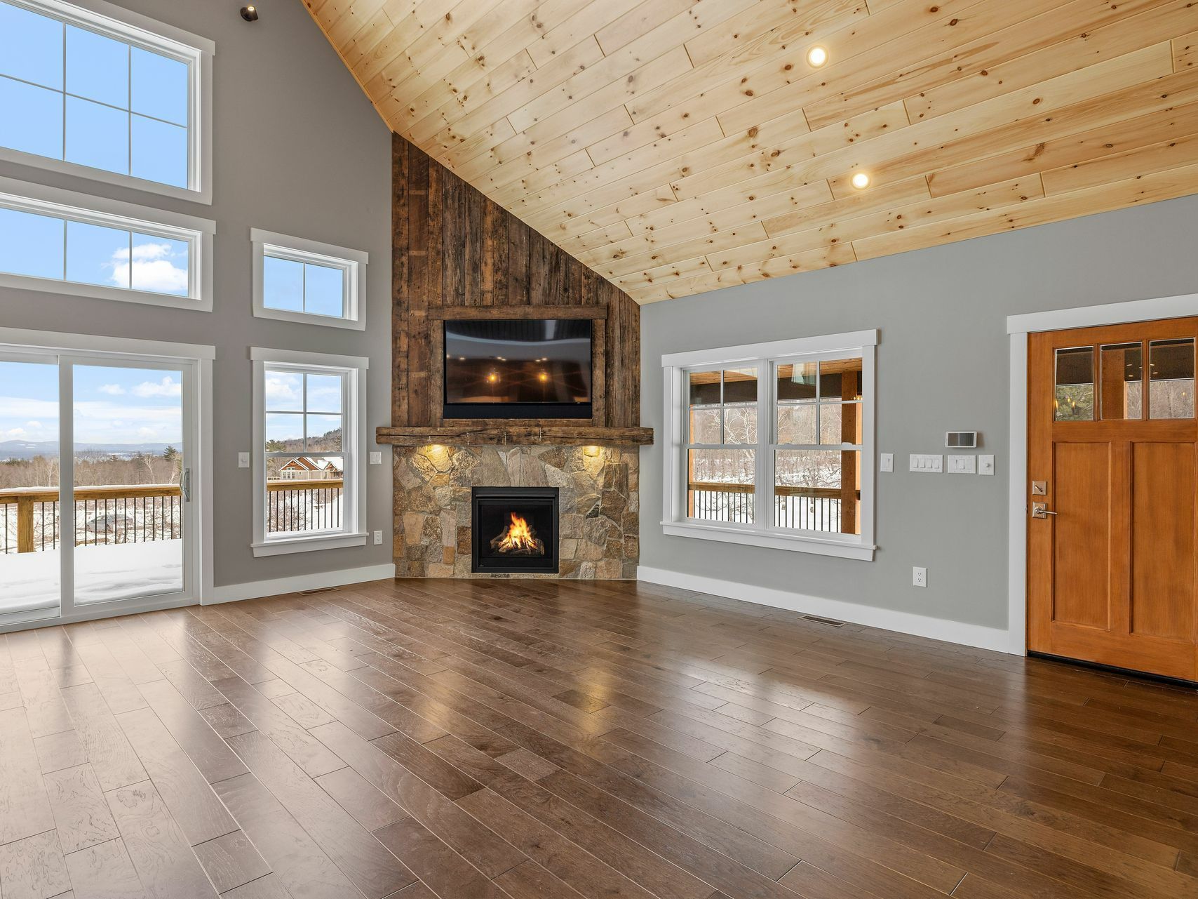 There is a fireplace in the middle of the living room.