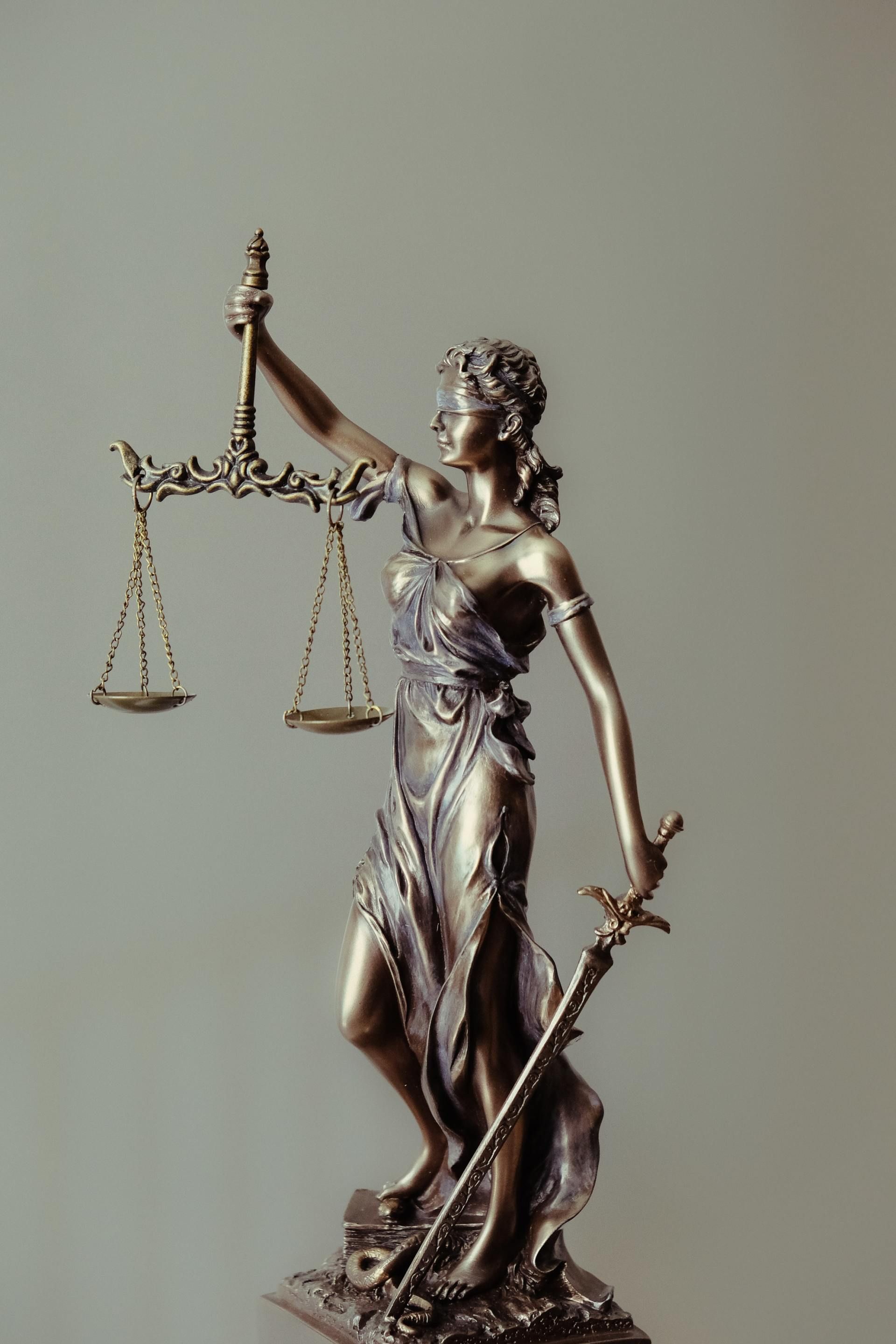 Lady Justice statue holding scales and a sword.